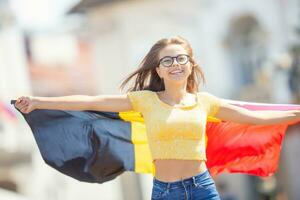 Attractive happy young girl with the Belgian flag photo