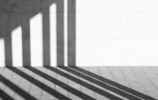 Abstract black and white space with shadow on concrete wall Used for textured backgrounds. photo