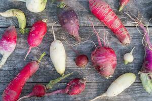 Variety of Radishes on a Wooden Table photo