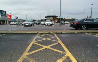 Low Angle View of Parkway Retail Business Park with Branded Showroom Outlets and Huge Car Parking Lot at Luton City Near to London Luton airport, England UK. Great Britain. Captured April 04th, 2023 photo