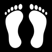 Foot print white silhouettes on black background vector