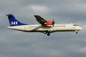 SAS Scandinavian Airlines ATR-72 OY-JZE passenger plane landing at Hamburg Airport photo