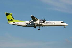 Air Baltic Bombardier DHC-8 Q400 YL-BAH passenger plane landing at Hamburg Airport photo