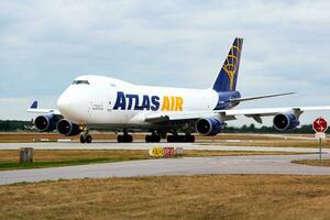 Atlas Air cargo plane at airport. Air freight and shipping. Aviation and aircraft. Transport industry. Global international transportation. Fly and flying. photo