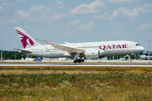 Qatar Airways passenger plane at airport. Schedule flight travel. Aviation and aircraft. Air transport. Global international transportation. Fly and flying. photo