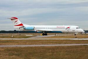 Austrian Airlines passenger plane at airport. Schedule flight travel. Aviation and aircraft. Air transport. Global international transportation. Fly and flying. photo