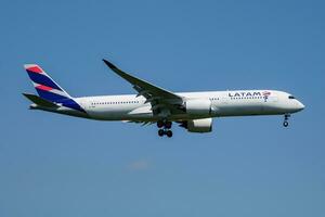 LATAM Brasil Qatar Airways Airbus A350-900 passenger plane arrival and landing at Munich Airport photo