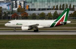 Alitalia Airbus A319 EI-IMH passenger plane departure at Munich Airport photo