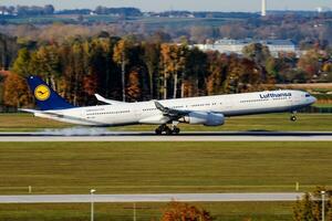 Lufthansa passenger plane at airport. Schedule flight travel. Aviation and aircraft. Air transport. Global international transportation. Fly and flying. photo