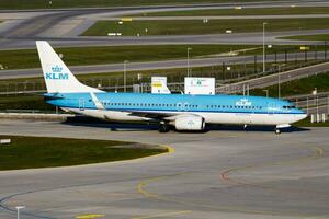 KLM passenger plane at airport. Schedule flight travel. Aviation and aircraft. Air transport. Global international transportation. Fly and flying. photo