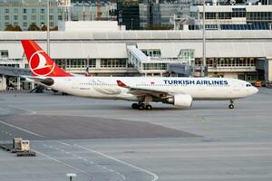 Turkish Airlines Airbus A330-200 TC-JNB passenger plane departure at Munich Airport photo