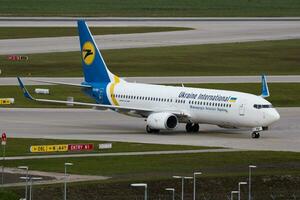 Ukraine International Airlines Boeing 737-800 UR-PSF passenger plane arrival and landing at Munich Airport photo