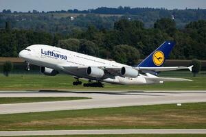 Lufthansa passenger plane at airport. Schedule flight travel. Aviation and aircraft. Air transport. Global international transportation. Fly and flying. photo