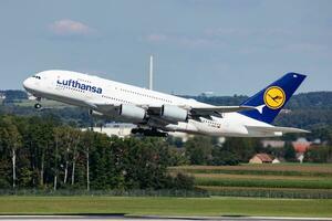 Lufthansa passenger plane at airport. Schedule flight travel. Aviation and aircraft. Air transport. Global international transportation. Fly and flying. photo