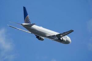 United Airlines passenger plane at airport. Schedule flight travel. Aviation and aircraft. Air transport. Global international transportation. Fly and flying. photo