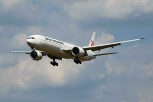 JAL Japan Airlines Boeing 777-300ER JA737J passenger plane landing at London Heathrow Airport photo