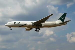 PIA Pakistan International Airlines Boeing 777-200 AP-BGL passenger plane landing at London Heathrow Airport photo