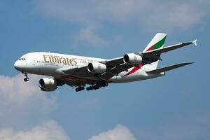 Emirates Airlines Airbus A380 A6-EEI passenger plane landing at London Heathrow Airport photo