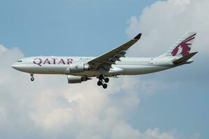 Qatar Airways Airbus A330-200 A7-ACM passenger plane landing at London Heathrow Airport photo