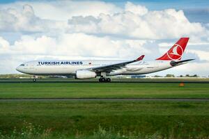 Turkish Airlines passenger plane at airport. Schedule flight travel. Aviation and aircraft. Air transport. Global international transportation. Fly and flying. photo