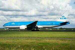 KLM Boeing 777-200 PH-BQP passenger plane departure at Amsterdam Schipol Airport photo