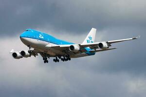 KLM Royal Dutch Airlines Boeing 747-400 PH-BFD passenger plane arrival and landing at Amsterdam Schipol Airport photo