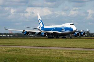 AirBridgeCargo Airlines Boeing 747-400 VP-BIK cargo plane arrival and landing at Amsterdam Schipol Airport photo