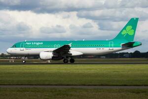 Aer Lingus Airbus A320 EI-DVI passenger plane departure at Amsterdam Schipol Airport photo