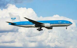 KLM Royal Dutch Airlines Boeing 777-200 PH-BQL passenger plane arrival and landing at Amsterdam Schipol Airport photo