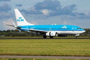 KLM Boeing 737-700 PH-BGO passenger plane landing at Amsterdam Schipol Airport photo