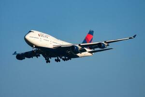 Delta Airlines passenger plane at airport. Schedule flight travel. Aviation and aircraft. Air transport. Global international transportation. Fly and flying. photo