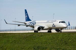 KLM passenger plane at airport. Schedule flight travel. Aviation and aircraft. Air transport. Global international transportation. Fly and flying. photo