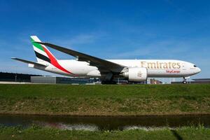 Emirates Sykcargo cargo plane at airport. Air freight and shipping. Aviation and aircraft. Transport industry. Global international transportation. Fly and flying. photo