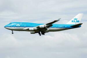 KLM Royal Dutch Airlines Boeing 747-400 PH-BFS passenger plane arrive and landing at Amsterdam Schipol Airport photo