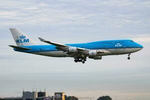 KLM Royal Dutch Airlines Boeing 747-400 PH-BFH passenger plane arrival and landing at Amsterdam Schipol Airport photo