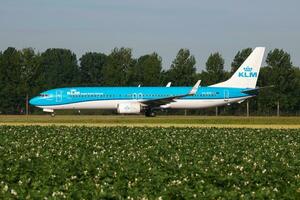 KLM Royal Dutch Airlines Boeing 737-800 PH-BXP passenger plane taxiing at Amsterdam Schipol Airport photo