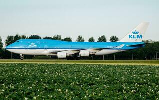 KLM Royal Dutch Airlines Boeing 747-400 PH-BFG passenger plane taxiing at Amsterdam Schipol Airport photo
