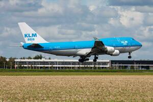 KLM Royal Dutch Airlines Boeing 747-400 PH-BFM passenger plane arrival and landing at Amsterdam Schipol Airport photo