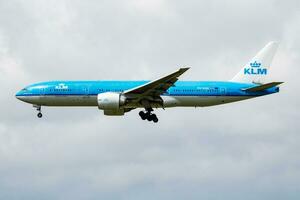 KLM Royal Dutch Airlines Boeing 777-200 PH-BQG passenger plane arrive and landing at Amsterdam Schipol Airport photo