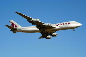 Qatar Airways Cargo Boeing 747-8 Jumbo Jet A7-BGA cargo plane arrival and landing at Luxembourg Findel airport photo