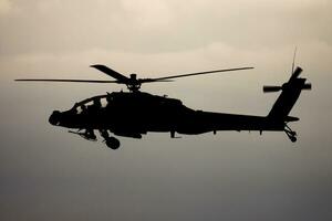 Military helicopter at air base. Air force flight operation. Aviation and aircraft. Air defense. Military industry. Fly and flying. photo