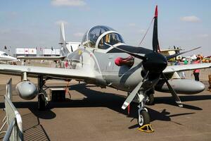 Military trainer plane at air base. Air force flight training. Aviation and aircraft. Aerobatic. Military industry. Fly and flying. photo