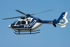 Government police helicopter at airport and airfield. Rotorcraft. General aviation industry. Police utility transportation. Air transport. Fly and flying. photo