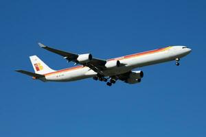 Iberia Airlines passenger plane at airport. Schedule flight travel. Aviation and aircraft. Air transport. Global international transportation. Fly and flying. photo