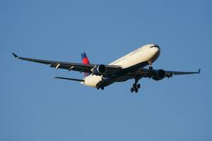 Delta Airlines passenger plane at airport. Schedule flight travel. Aviation and aircraft. Air transport. Global international transportation. Fly and flying. photo