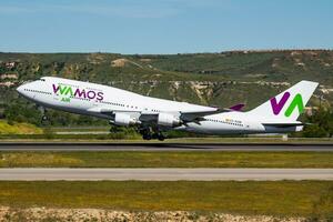 Wamos Air passenger plane at airport. Schedule flight travel. Aviation and aircraft. Air transport. Global international transportation. Fly and flying. photo