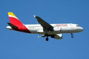 Iberia Airlines Airbus A319 EC-KMD passenger plane landing at Madrid Barajas Airport photo