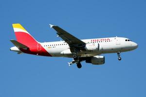 Iberia Airlines Airbus A319 EC-MFP passenger plane landing at Madrid Barajas Airport photo