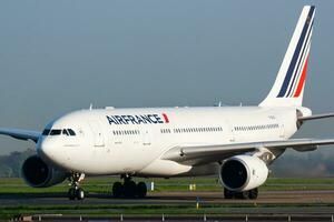 Air France Airbus A330-200 F-GZCK passenger plane arrival and landing at Paris Charles de Gaulle Airport photo