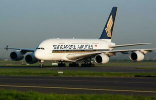 Singapore Airlines Airbus A380 9V-SKB passenger plane arrival and landing at Paris Charles de Gaulle Airport photo